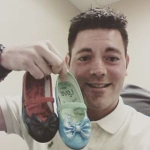 Brandon Watkins with Erin's shoes